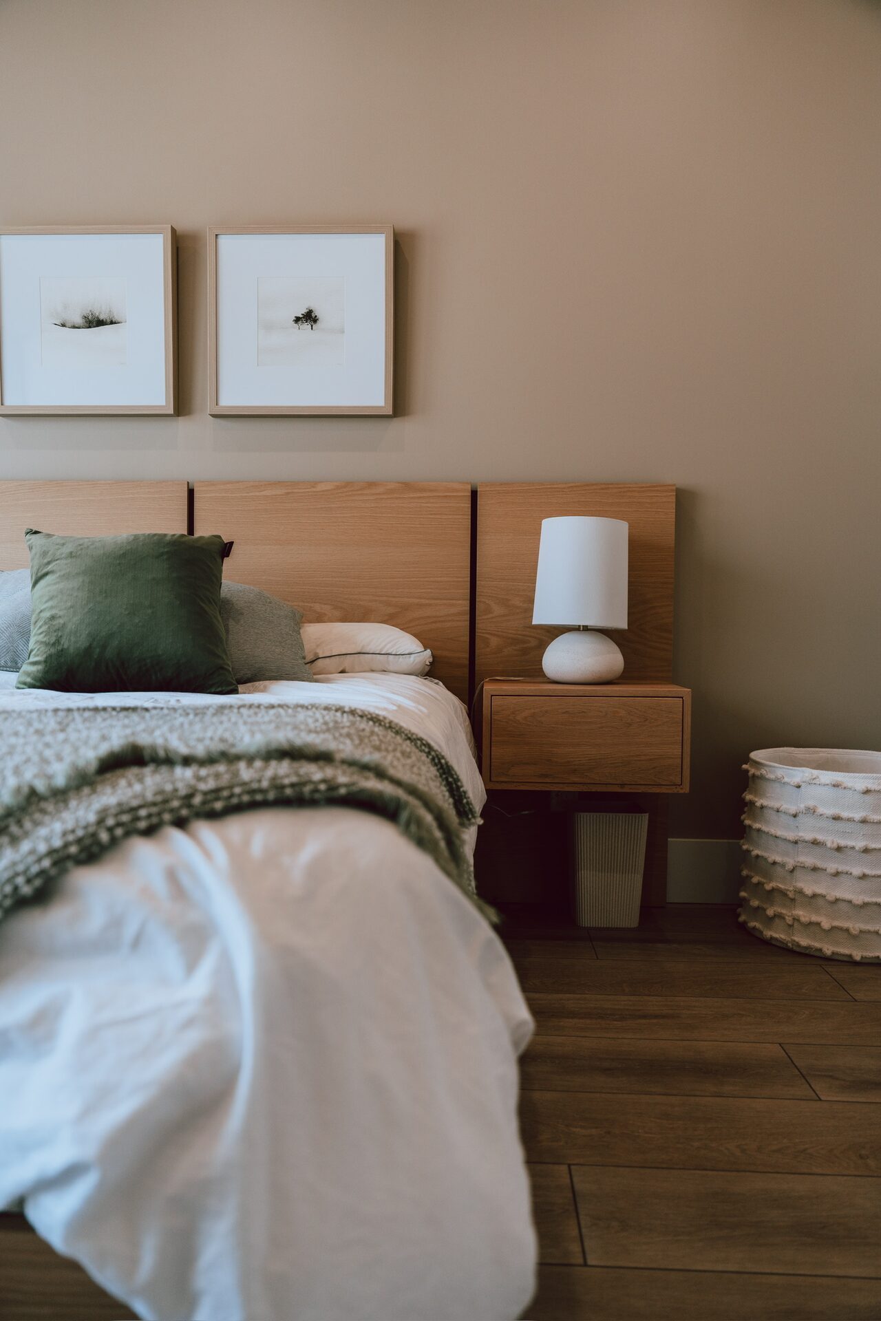 Custom bedroom furniture with wood headboard and nightstand by Bateman Fine Cabinetry