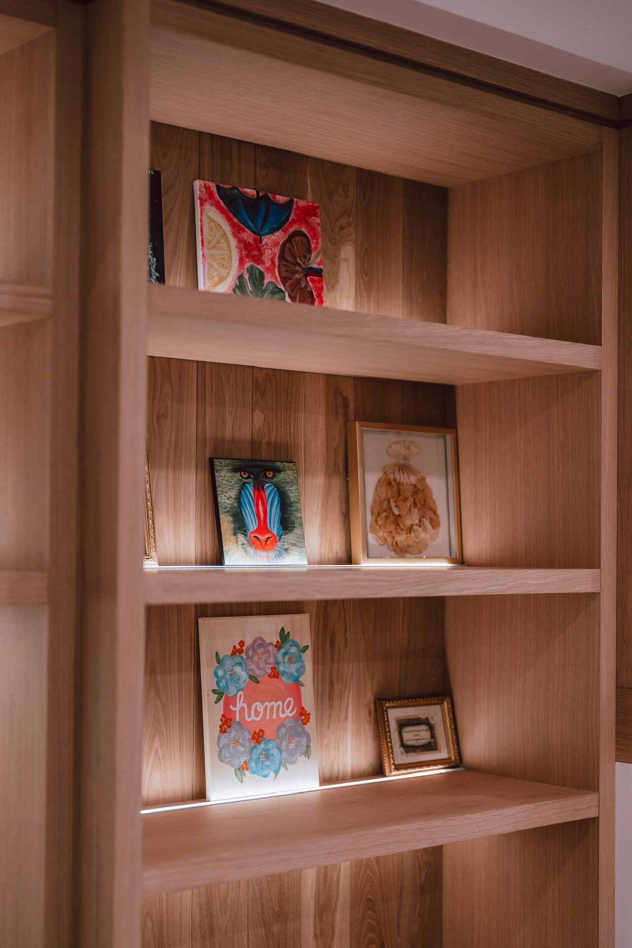 Close-up of custom built-in shelving with art and decor